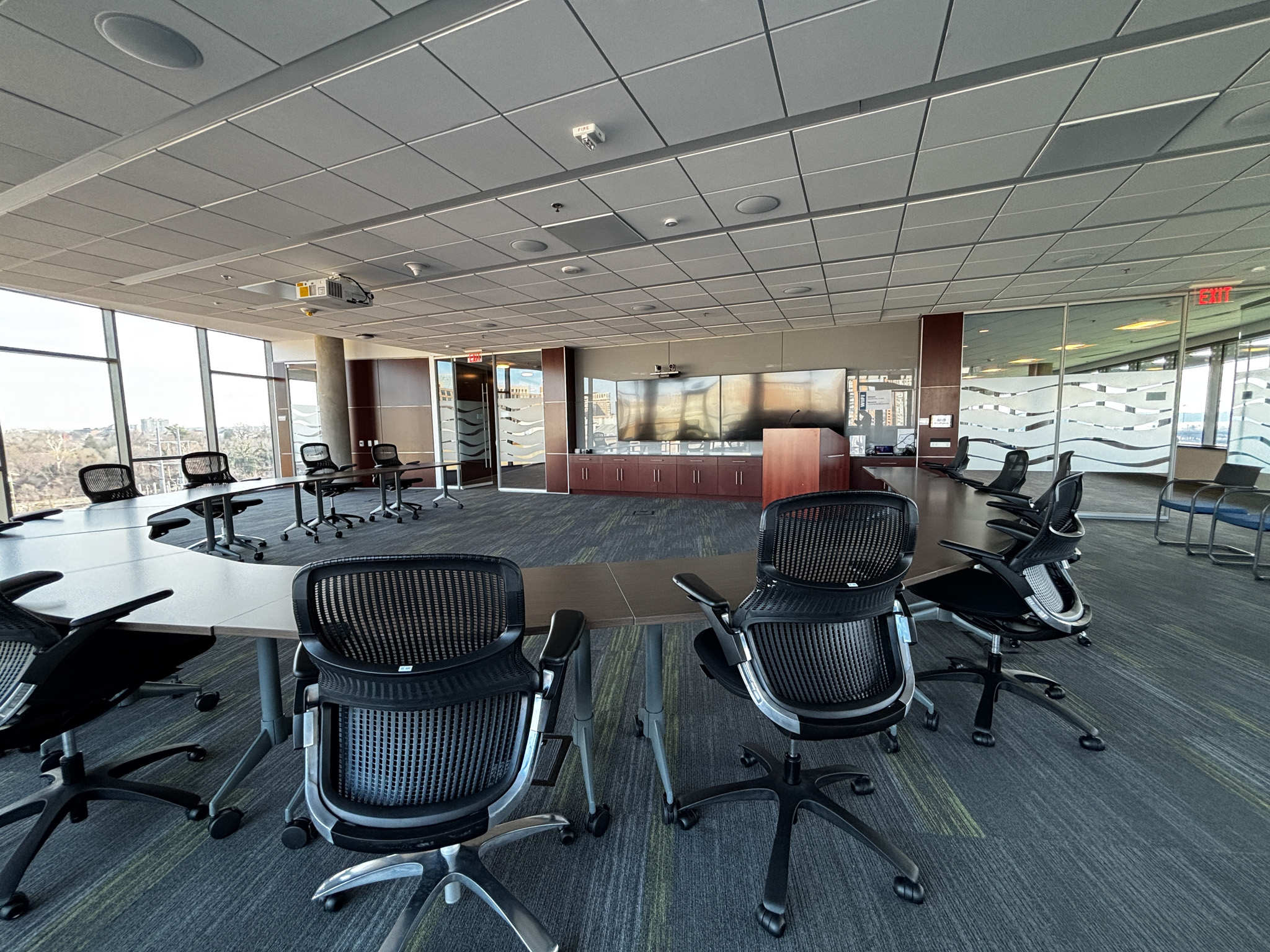 conference room space with tables arranged in a circle.